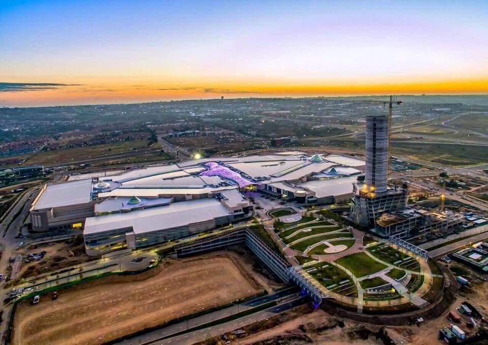 Mall of Africa illuminated at dusk following completion