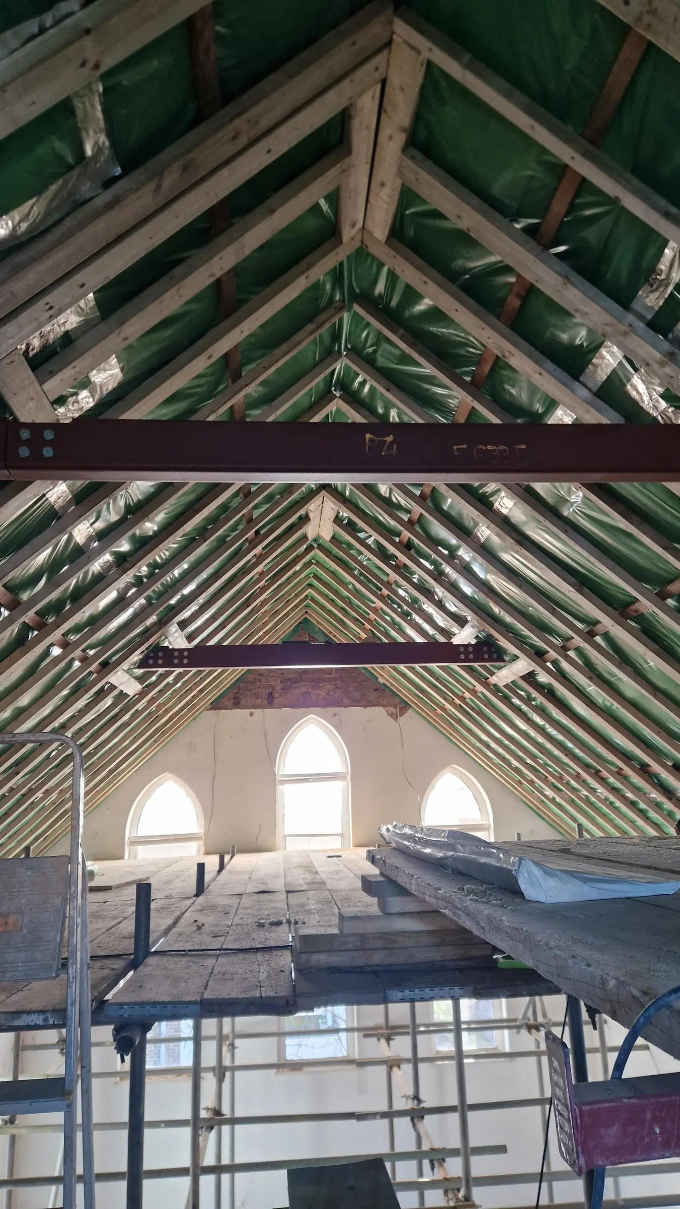 Roof strengthening integrated with the existing timber rafters at Trinity Close